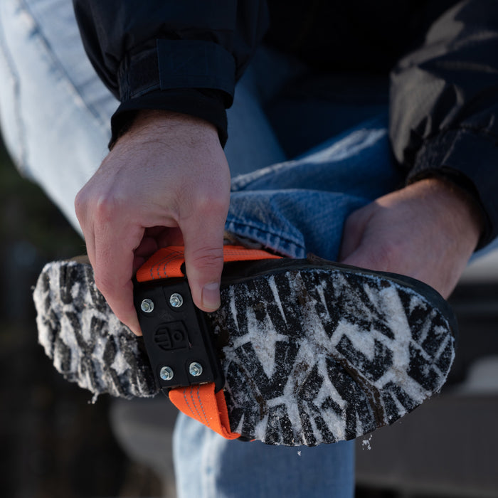 MIDCLEAT Midsole Ice Traction Cleats offer superior grip and stability. MIDCLEAT is designed to provide versatile traction for anyone who frequently moves from outdoors to indoors as the cleat can easily and quickly be flipped to the top of the boot to prevent slipping or marking floors